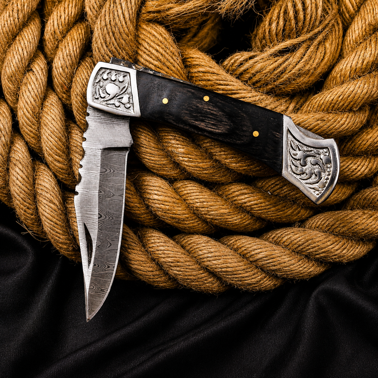 Handmade Damascus Steel Folding Knife | Black Wood Handle & Engraved Bolsters