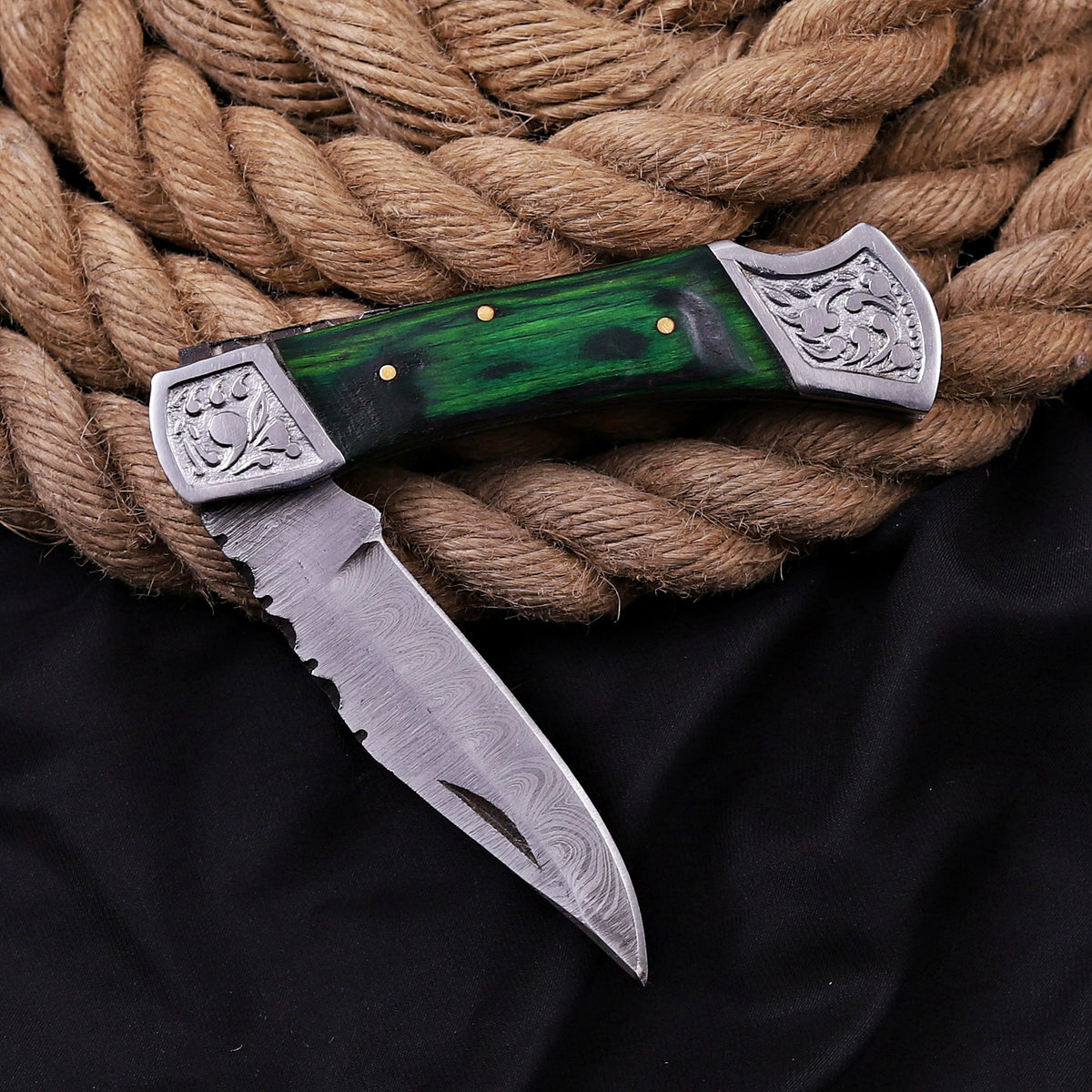 Handmade Damascus Steel Folding Knife | Black Wood Handle & Engraved Bolsters